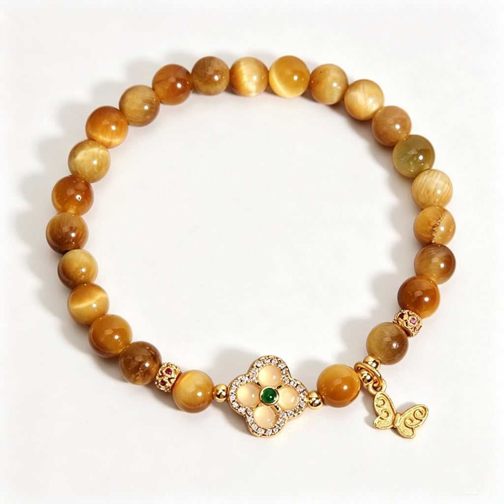 Earth Element golden tiger's eye bracelet, oriental five elements aesthetic women jewelry with four-leaf clover and butterfly pendant, plain white background e-commerce product shot