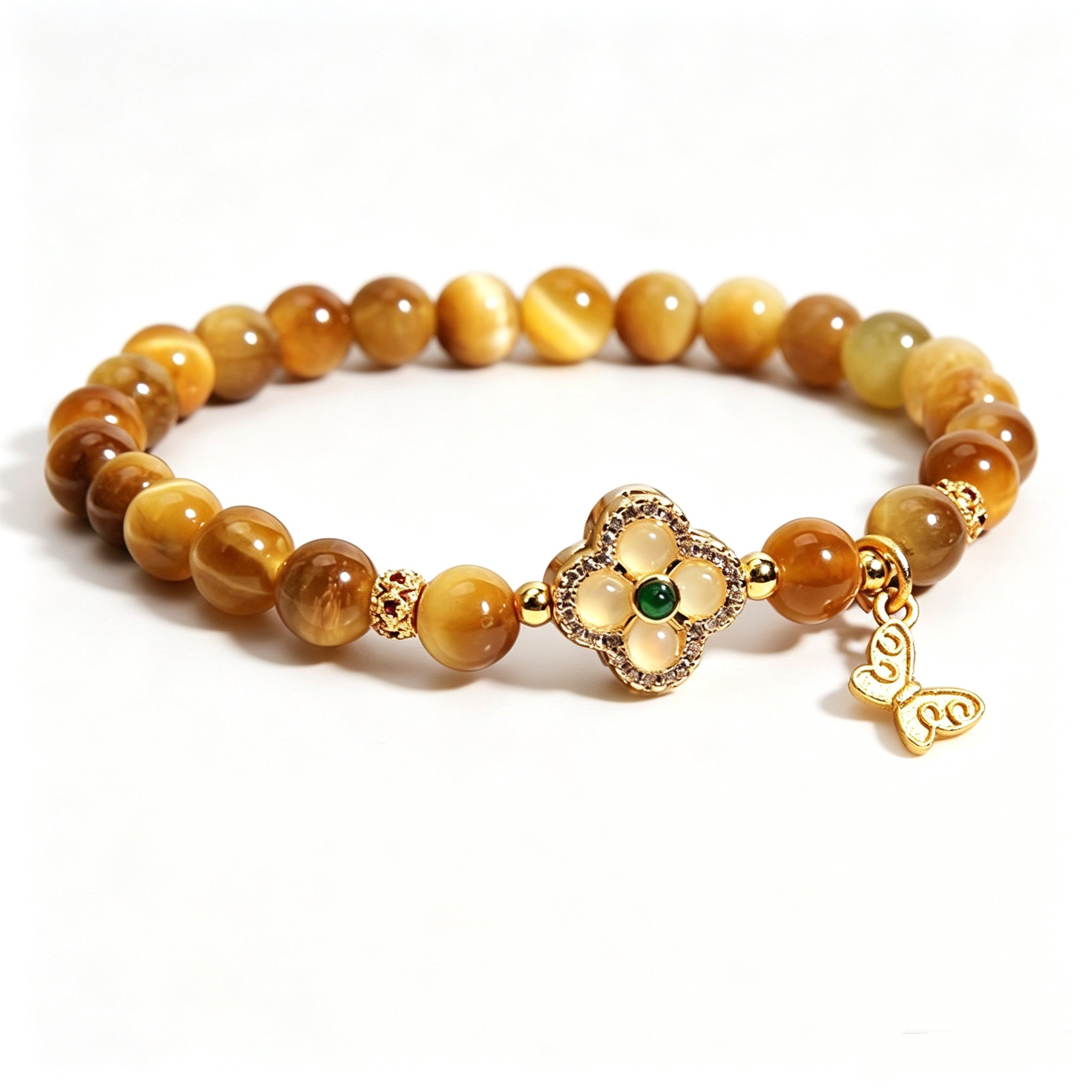 Close-up of natural golden tiger's eye beads with silky cat-eye luster, earth element women bracelet detail shot, clean white background