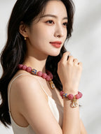 Elegant pink tourmaline fire aesthetic bracelet worn on female wrist, delicate handmade friendship gift jewelry for ladies