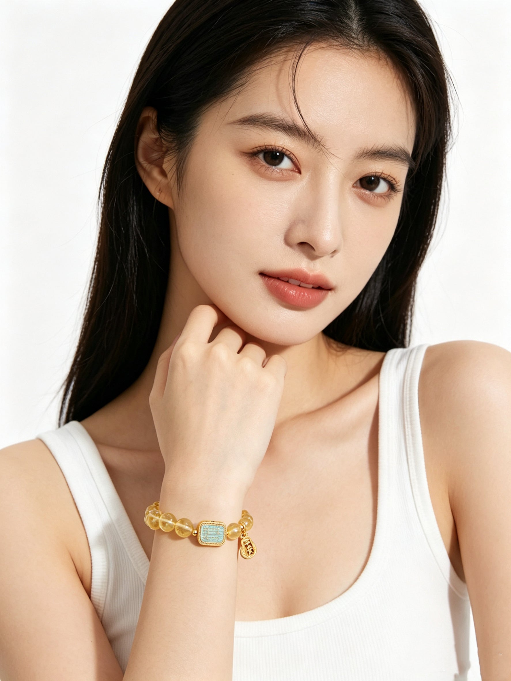 Partial upper body shot of woman in minimalist white vest showcasing warm golden tone citrine bracelet, clean all-white background, new oriental aesthetic daily accessory