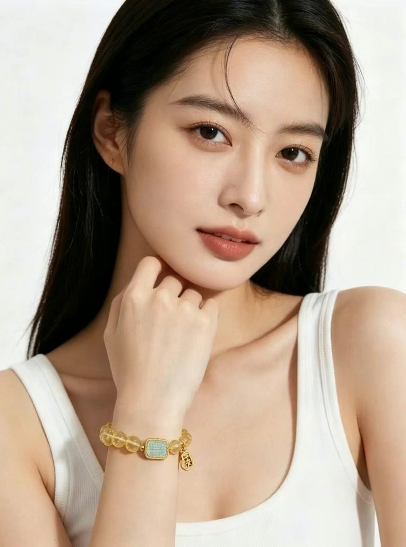 3:4 vertical styling short video showing warm golden citrine bracelet matching simple white casual daily outfit, partial upper body female model shot, clean white studio background