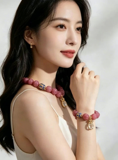 Vertical slow motion video showcasing oriental fire series pink tourmaline bracelet on female wrist, delicate handmade stone jewelry daily wearing effect, no face visible
