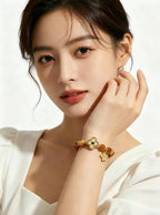 Slow close-up vertical video of woman rotating wrist to show cat-eye luster of Earthly Nurture tiger's eye bracelet, solid white background, no extra accessories