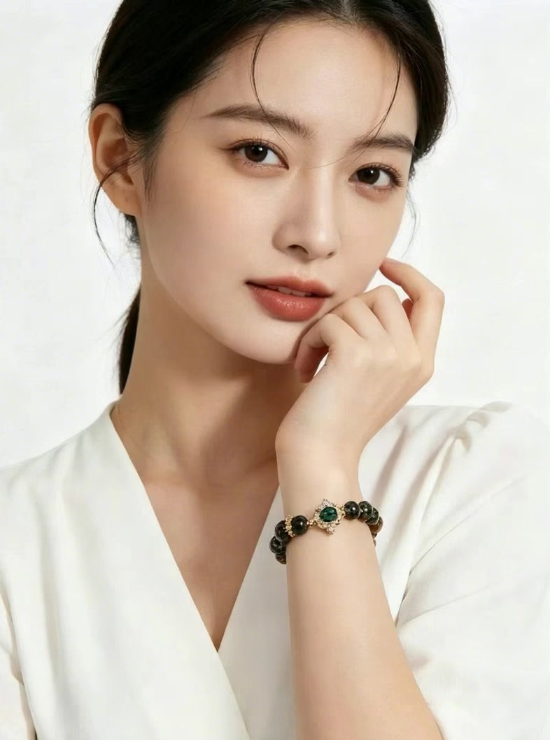 Vertical 3:4 slow motion footage displaying Wooden Growth green phantom crystal bracelet worn on female wrist, model in plain white clothes, plain white background oriental fashion jewelry showcase, no extra accessories