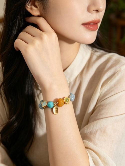 Close-up shot of female wrist wearing Water Element aquamarine bracelet, minimalist oriental handmade natural stone jewelry for daily wear