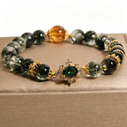 top full layout shot of wood element green phantom crystal bracelet, complete display of natural green phantom beads and golden fittings, minimalist white studio background