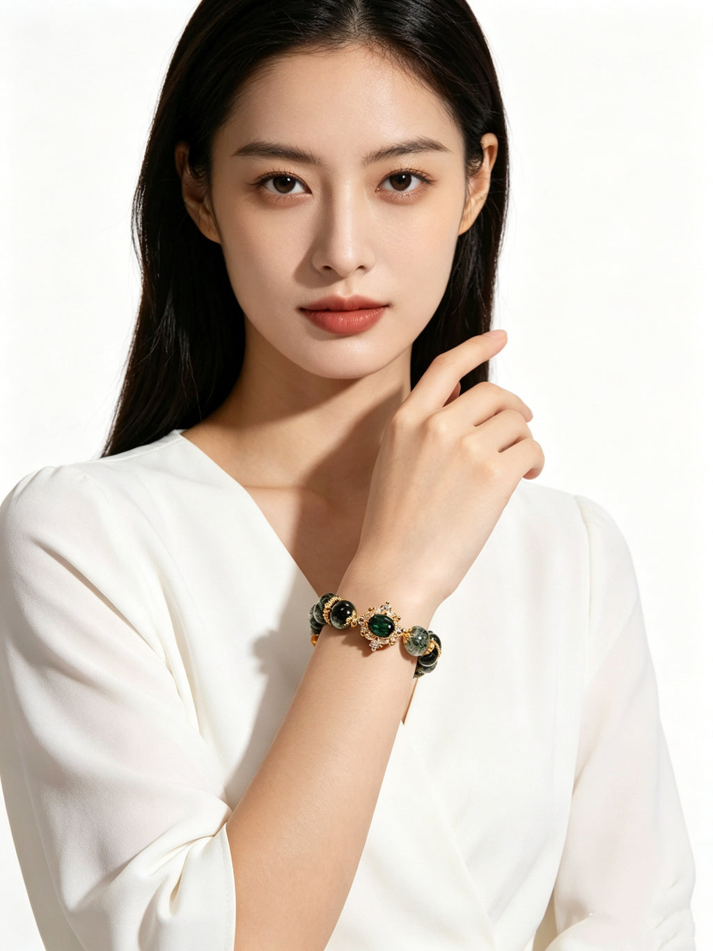 Extreme close-up of female wrist with wood element green phantom crystal bracelet, lady wearing simple white top, zero other jewelry, soft studio lighting on pure white backdrop
