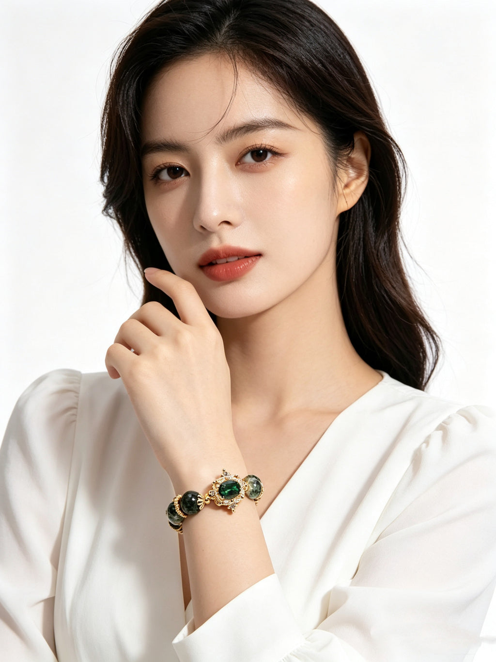 Close-up of female slender hand displaying wood element five elements green phantom bracelet, solid white outfit, no additional jewelry, minimalist pure white studio background